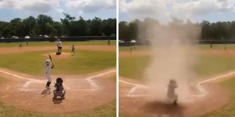 Niño queda en el centro de un remolino de arena durante partido de béisbol